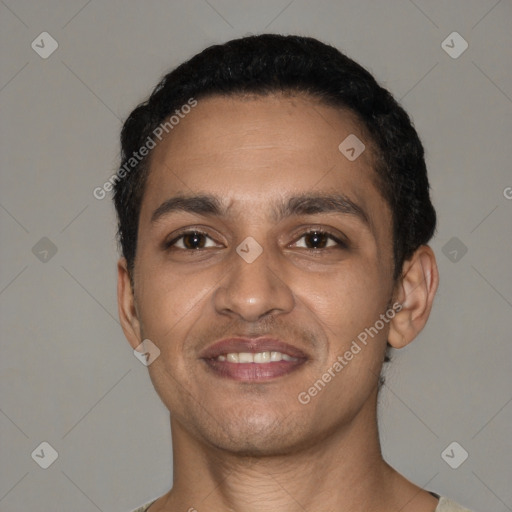 Joyful latino young-adult male with short  black hair and brown eyes