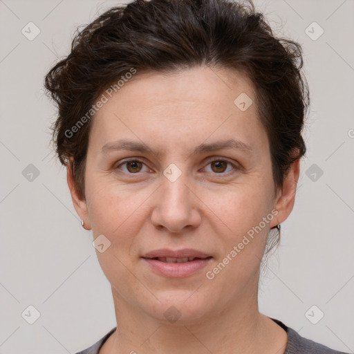 Joyful white adult female with short  brown hair and brown eyes