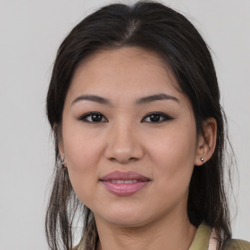 Joyful white young-adult female with medium  brown hair and brown eyes