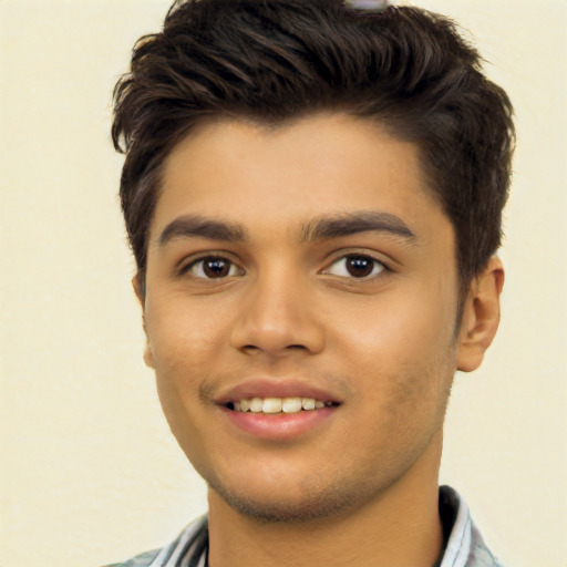 Joyful white young-adult male with short  black hair and brown eyes