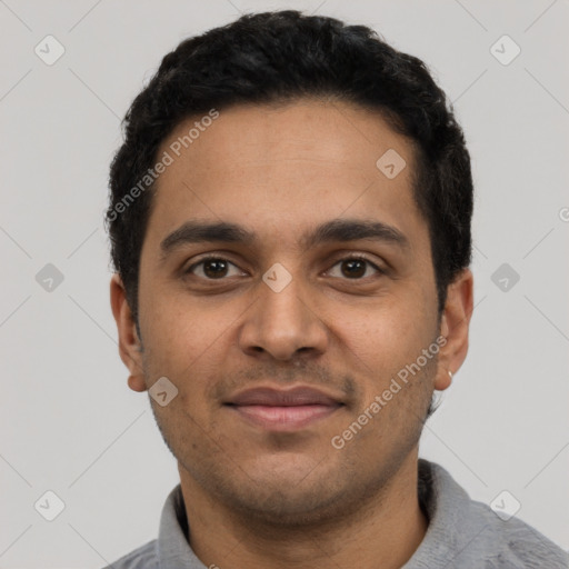 Joyful latino young-adult male with short  black hair and brown eyes