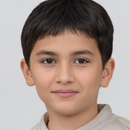 Joyful white child male with short  brown hair and brown eyes