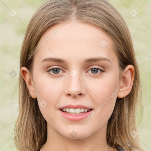 Joyful white young-adult female with long  brown hair and green eyes