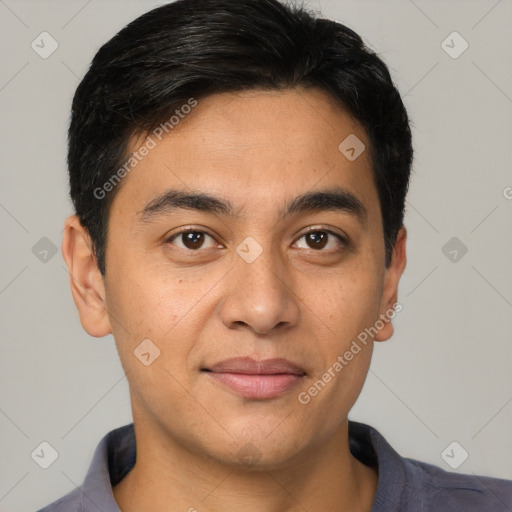 Joyful asian young-adult male with short  brown hair and brown eyes