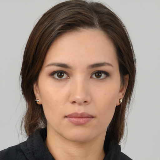 Neutral white young-adult female with medium  brown hair and brown eyes