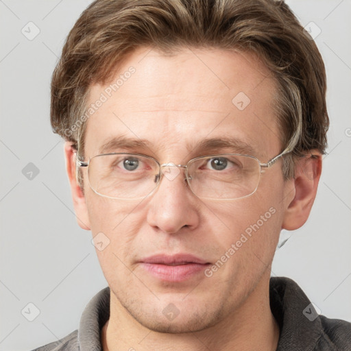 Joyful white adult male with short  brown hair and grey eyes