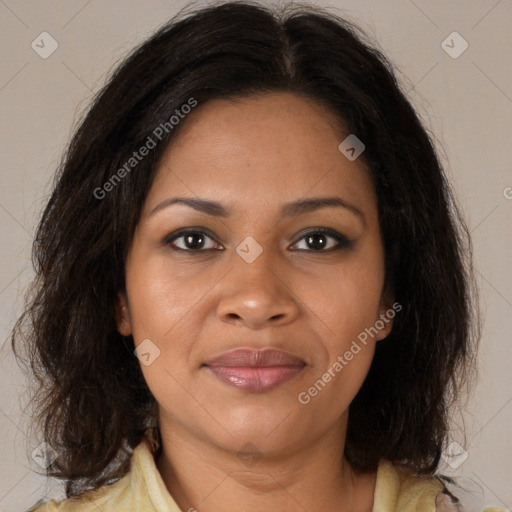 Joyful black adult female with medium  brown hair and brown eyes
