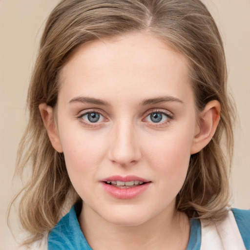 Joyful white young-adult female with medium  brown hair and blue eyes