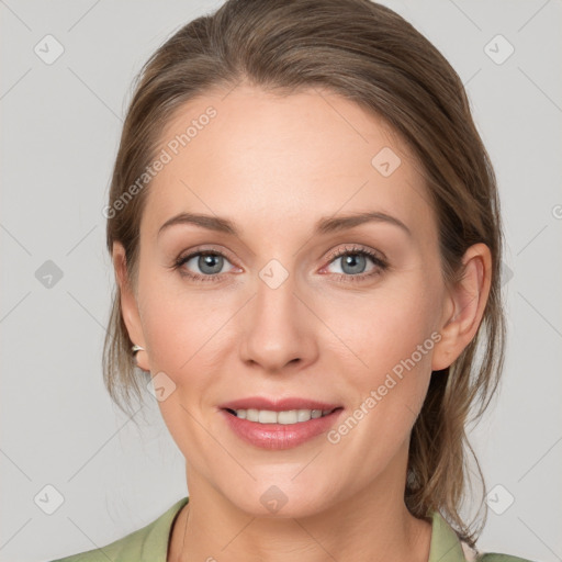 Joyful white young-adult female with medium  brown hair and grey eyes