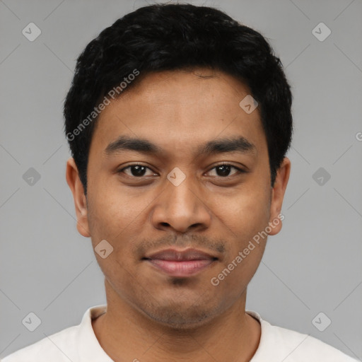 Joyful latino young-adult male with short  black hair and brown eyes