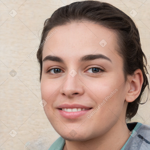 Joyful white young-adult female with medium  brown hair and grey eyes