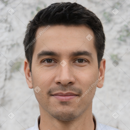 Joyful white young-adult male with short  black hair and brown eyes