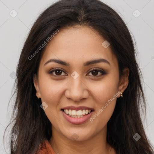 Joyful latino young-adult female with long  brown hair and brown eyes