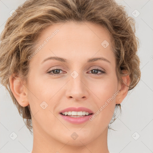 Joyful white young-adult female with medium  brown hair and green eyes