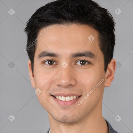 Joyful white young-adult male with short  black hair and brown eyes