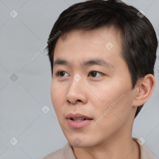 Neutral asian young-adult male with short  black hair and brown eyes