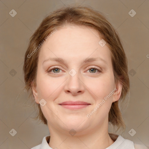 Joyful white adult female with medium  brown hair and brown eyes