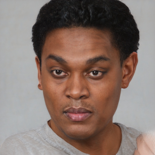Neutral black young-adult male with short  black hair and brown eyes
