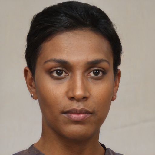 Neutral black young-adult female with short  brown hair and brown eyes