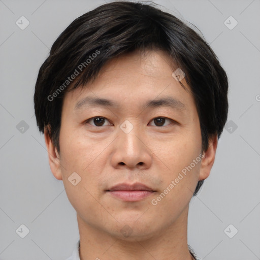 Neutral asian young-adult male with short  brown hair and brown eyes