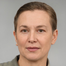 Joyful white adult female with short  brown hair and grey eyes