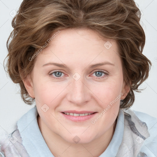 Joyful white young-adult female with medium  brown hair and blue eyes