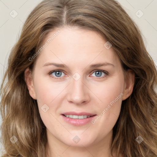 Joyful white young-adult female with long  brown hair and green eyes