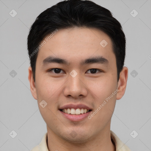 Joyful asian young-adult male with short  black hair and brown eyes