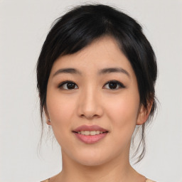 Joyful asian young-adult female with medium  black hair and brown eyes