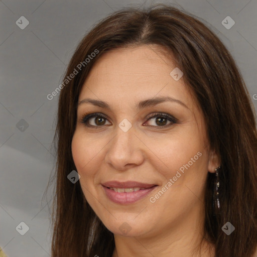 Joyful white adult female with long  brown hair and brown eyes