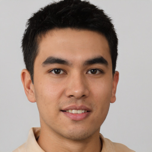 Joyful asian young-adult male with short  brown hair and brown eyes