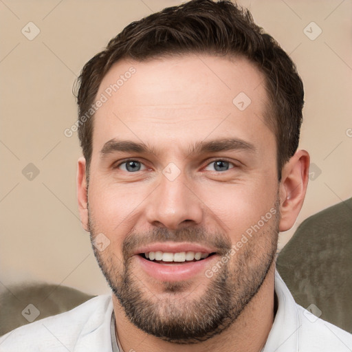 Joyful white young-adult male with short  brown hair and brown eyes