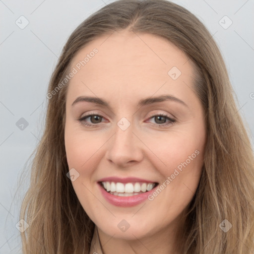 Joyful white young-adult female with long  brown hair and grey eyes