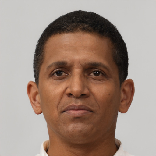 Neutral latino adult male with short  brown hair and brown eyes