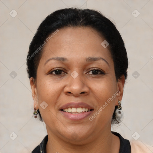 Joyful latino adult female with short  brown hair and brown eyes