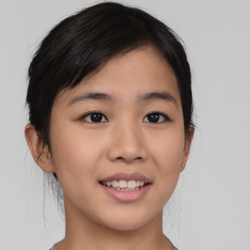 Joyful asian young-adult female with medium  black hair and brown eyes