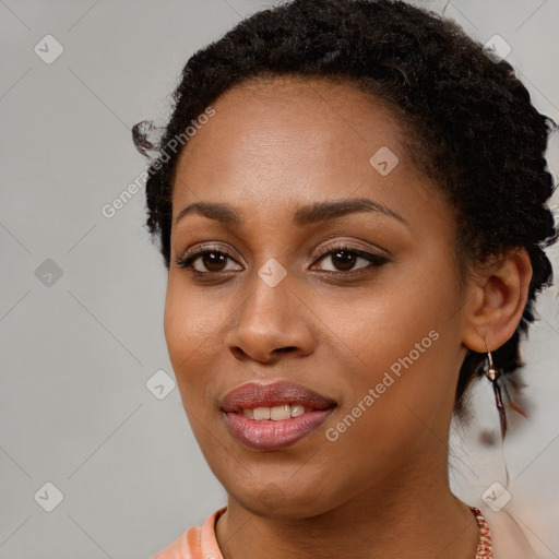 Joyful black young-adult female with long  brown hair and brown eyes