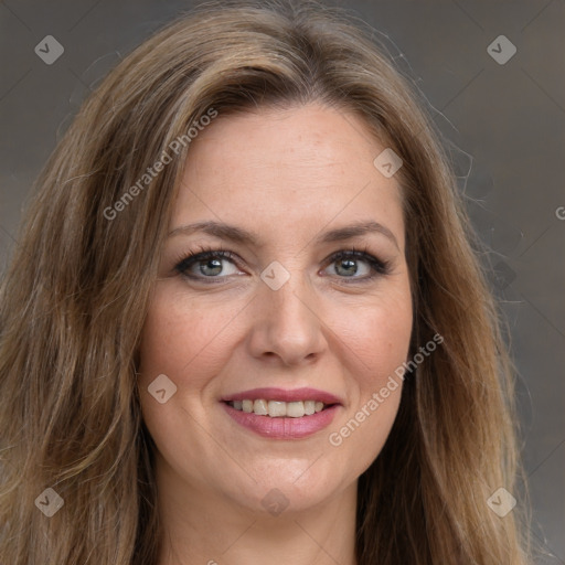 Joyful white young-adult female with long  brown hair and green eyes