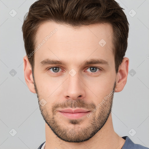 Neutral white young-adult male with short  brown hair and grey eyes