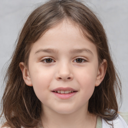 Joyful white child female with medium  brown hair and brown eyes