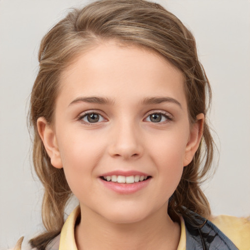 Joyful white child female with medium  brown hair and grey eyes