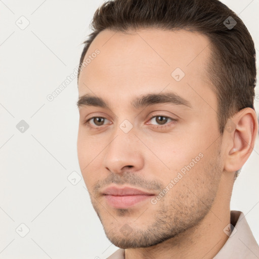 Neutral white young-adult male with short  brown hair and brown eyes