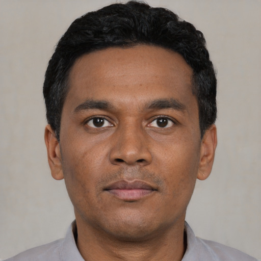 Neutral black young-adult male with short  black hair and brown eyes