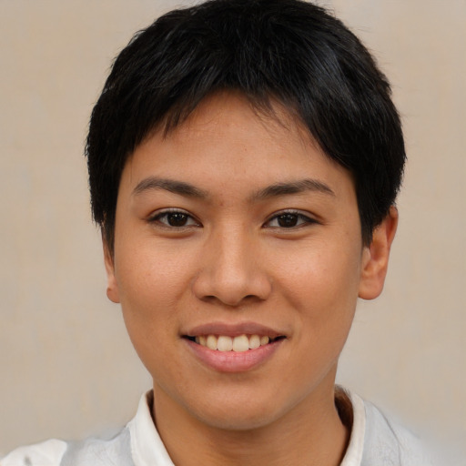 Joyful asian young-adult female with short  black hair and brown eyes