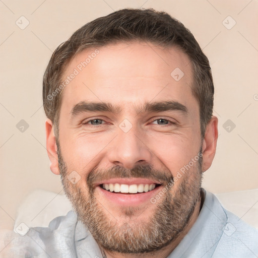 Joyful white adult male with short  brown hair and brown eyes