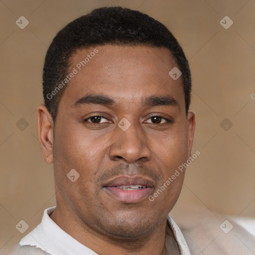 Joyful latino young-adult male with short  brown hair and brown eyes