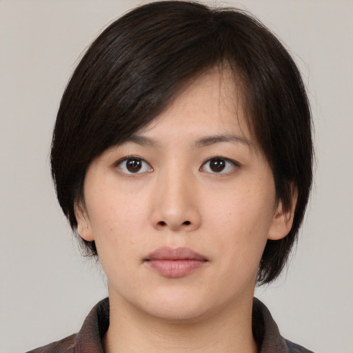 Neutral asian young-adult female with medium  brown hair and brown eyes