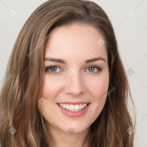 Joyful white young-adult female with long  brown hair and green eyes