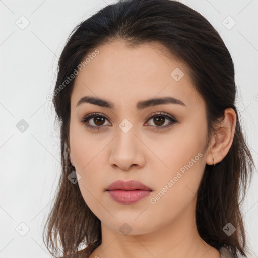 Joyful asian young-adult female with long  brown hair and brown eyes