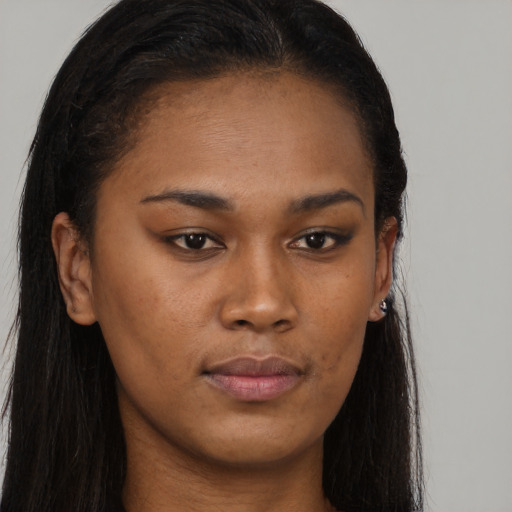 Neutral black young-adult female with long  brown hair and brown eyes